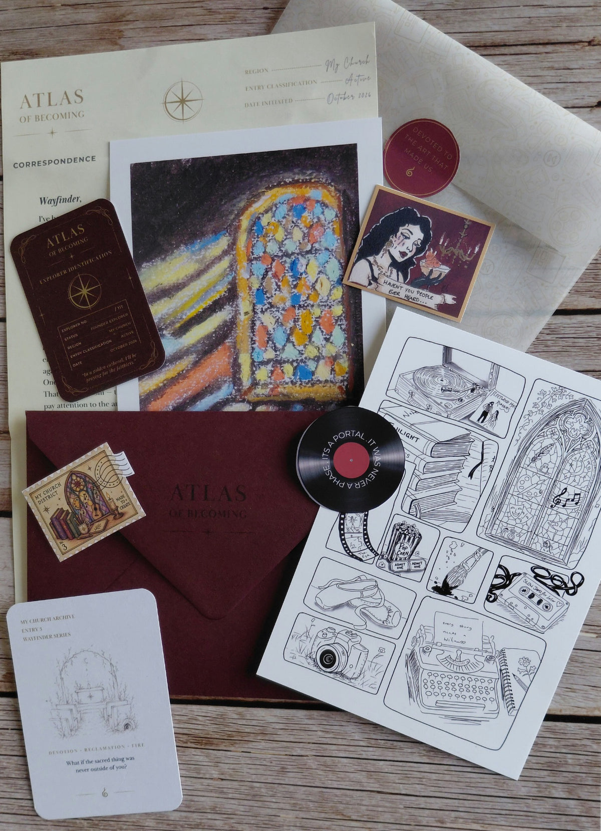 My Church Archive Dispatch from Atlas of Becoming, arranged in a burgundy art-inspired flat lay